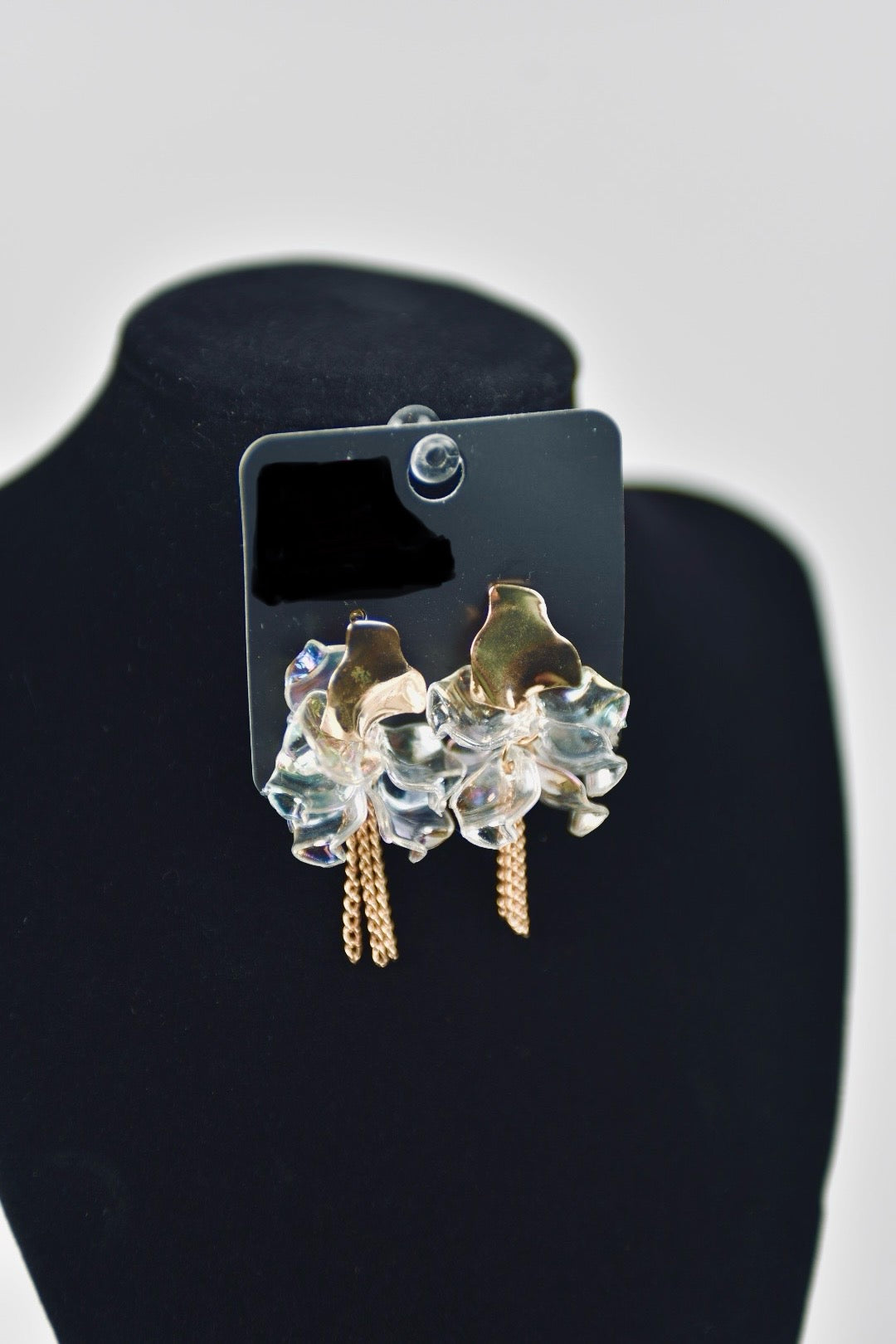 Women’s Gold and Transparent design earrings.